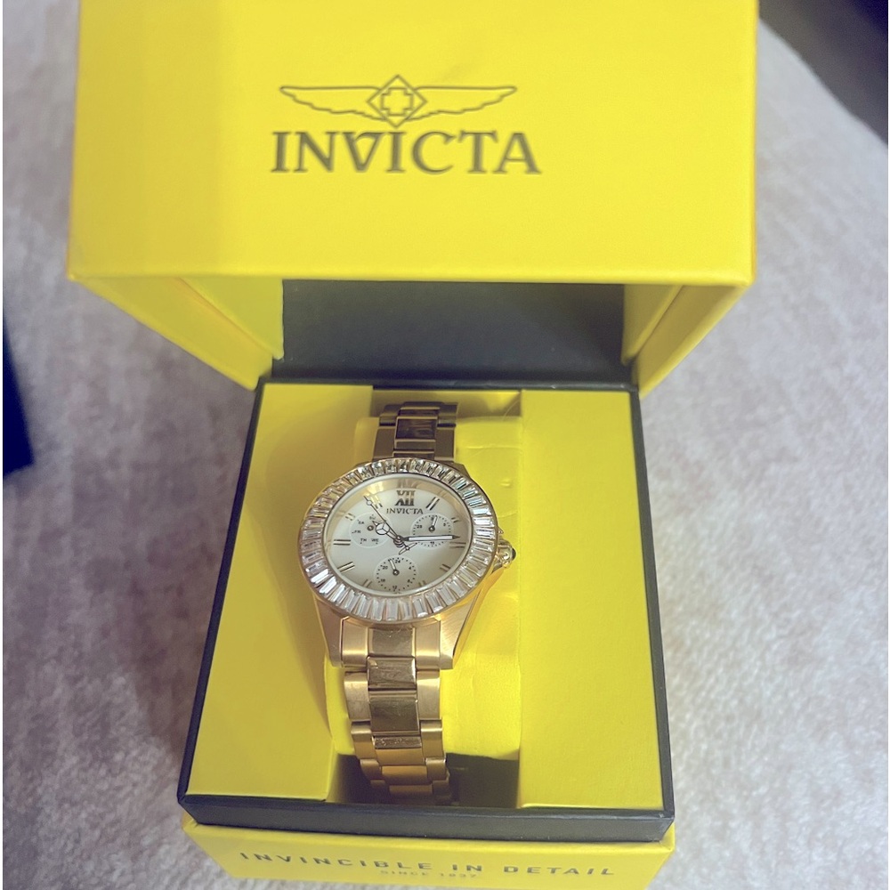 Gold Invitca Angel Quartz Chronograph with crystals on the face of the watch.